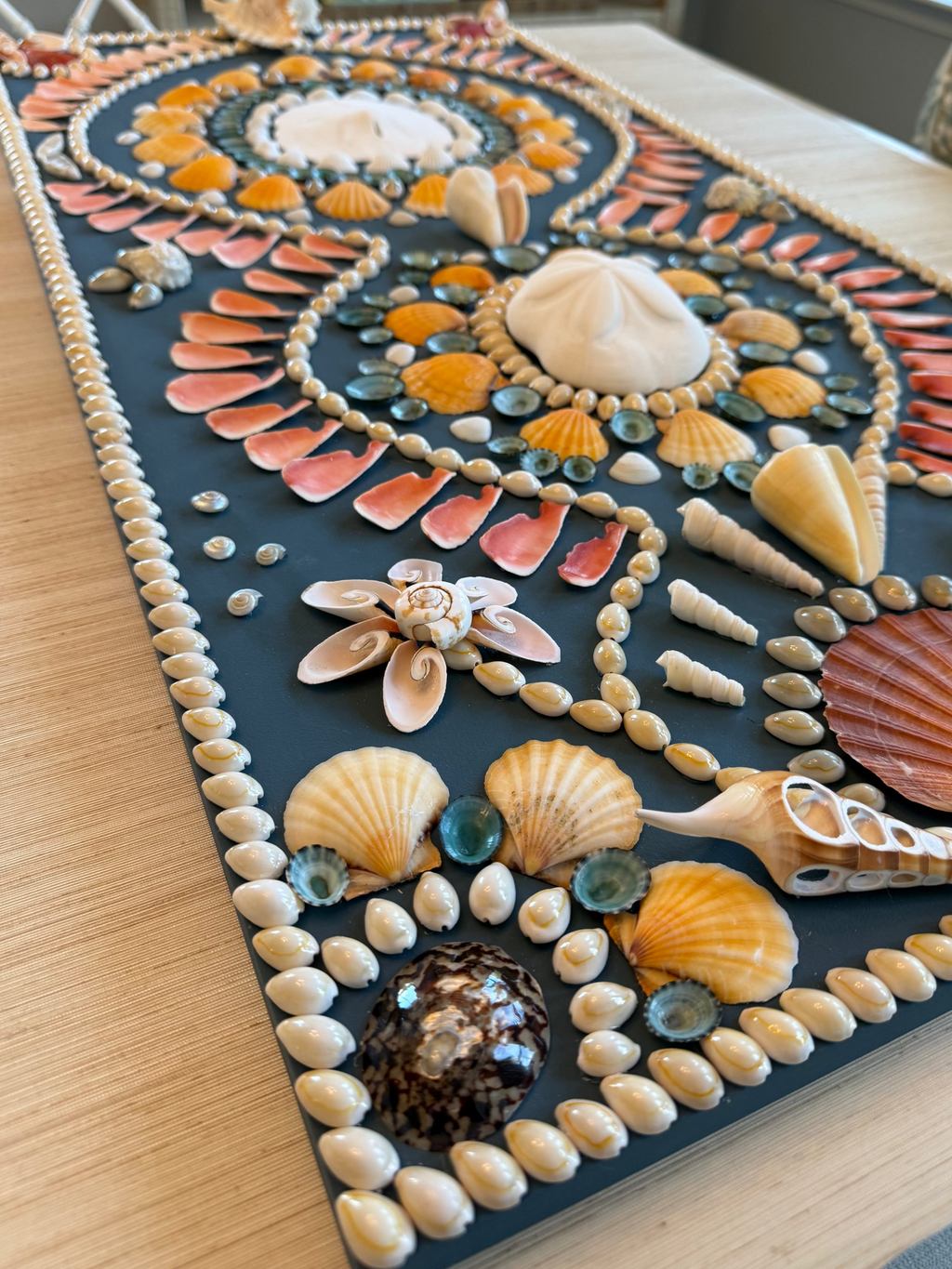 Tempe star shell panel with repeating mandala designs in earth tones, turquoise, and coral shells on dark background, 18 x 36 inches